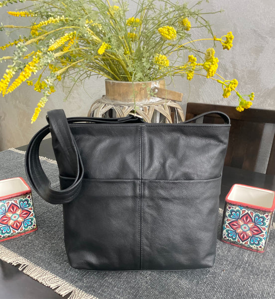 A messenger bag . Tote bag. - Avi Algrisi